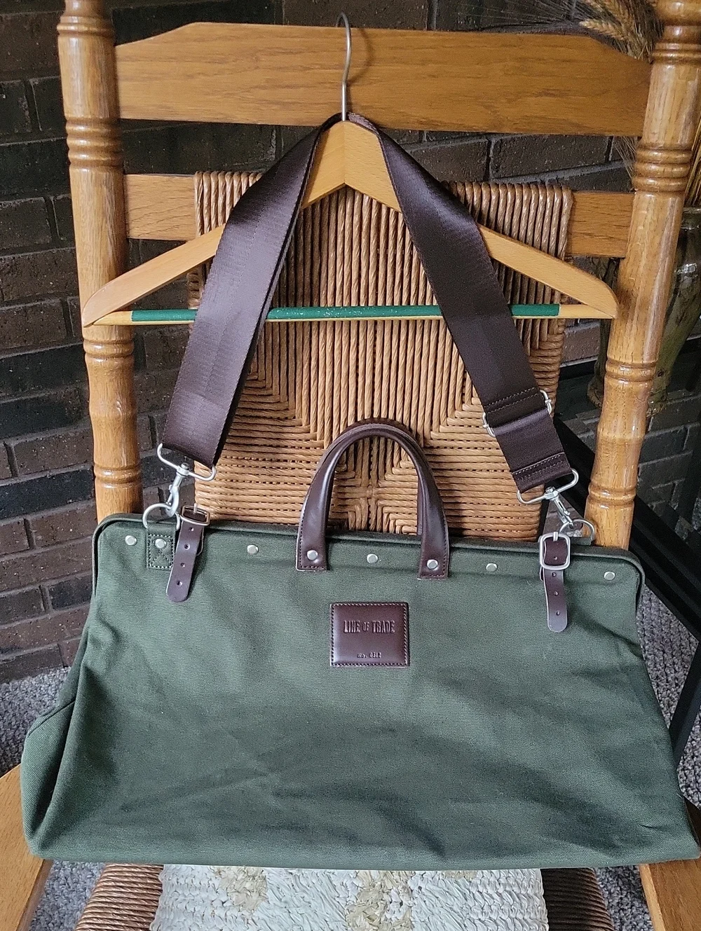 Line of Trade green military duffle sack with brown canvas strap